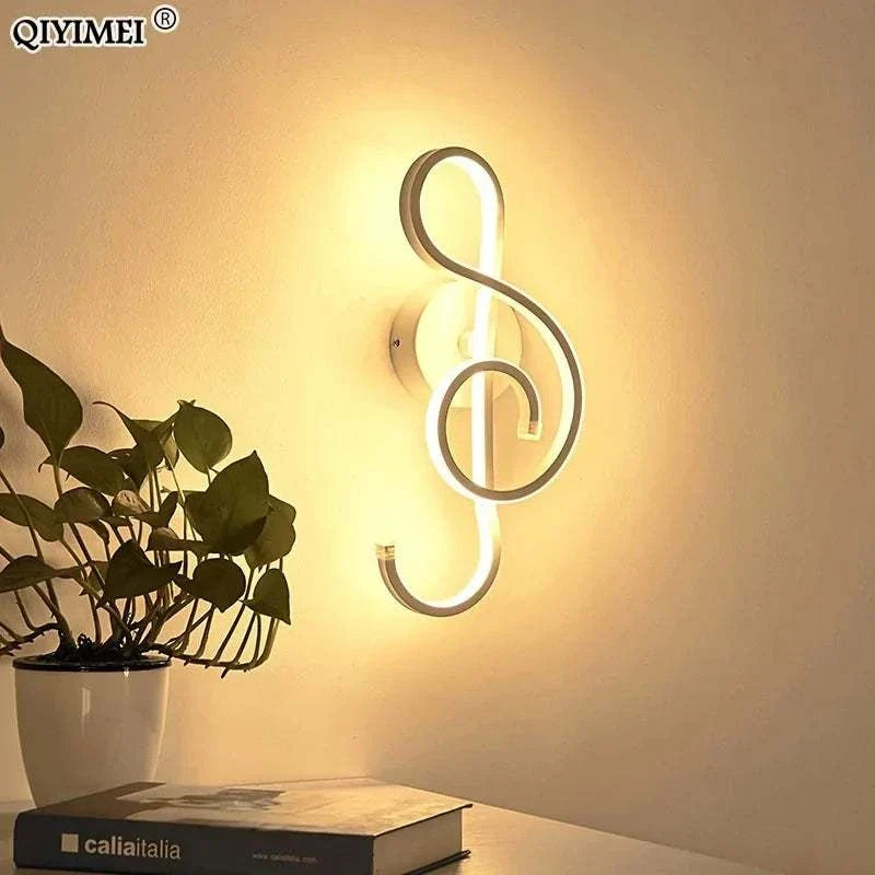 Modern Wall Lamps with sleek white acrylic and aluminum in an artistic figure-eight design illuminating warmly