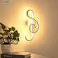 Modern Wall Lamps with sleek white acrylic and aluminum in an artistic figure-eight design illuminating warmly