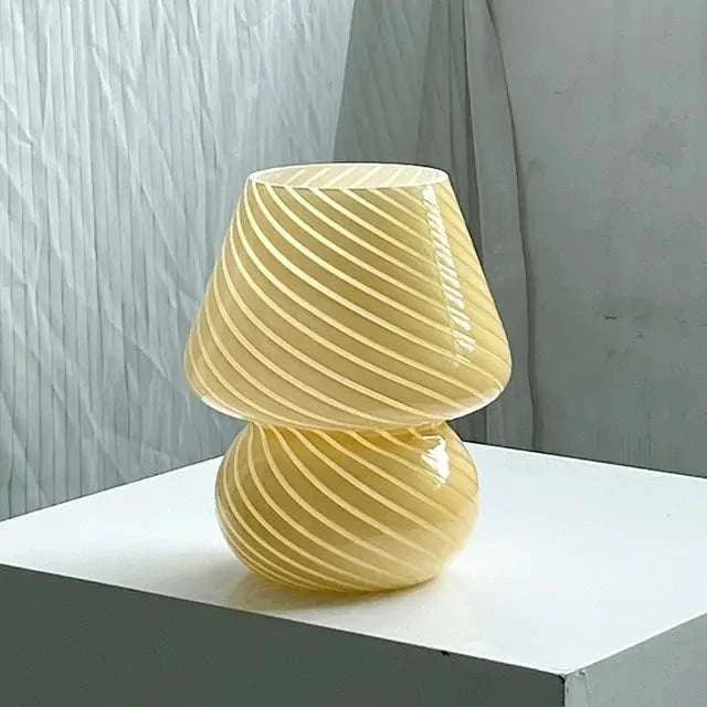 Mushroom LED Lamp in yellowish amber glass with a spiral stripe pattern and a bubble streamline design