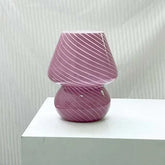 Mushroom LED Lamp in dusty pink hand-blown glass with spiral white stripes, compact and stylish desk light