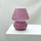 Mushroom LED Lamp in dusty pink hand-blown glass with spiral white stripes, compact and stylish desk light