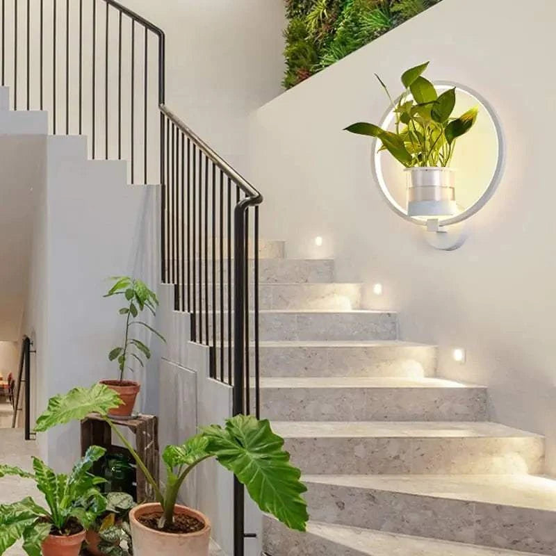 Modern wall plant LED lamp with lush greenery and soft LED lighting mounted on a wall