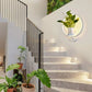 Modern wall plant LED lamp with lush greenery and soft LED lighting mounted on a wall