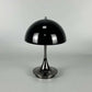Portable Rechargeable LED Lamp with black metal dome shade and sleek alloy base featuring a button on the side