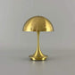 Portable Rechargeable LED Lamp with dimming feature, metallic gold finish and dome-shaped shade, sleek alloy and acrylic construction