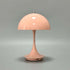 Portable Rechargeable LED Lamp in soft peach color with dome-shaped shade and smooth alloy finish featuring USB Type-C charging port