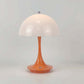 Portable Rechargeable LED Lamp with a glossy white dome-shaped shade and a smooth orange tapered base with touch control