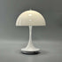 Portable Rechargeable LED Lamp in glossy white with dome-shaped acrylic shade and slim base featuring a charging port