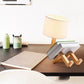 Robot Table Lamp with white fabric lampshade and wooden base doubling as a book holder on a desk surface.