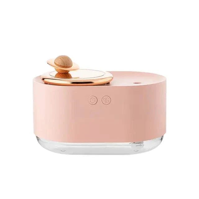 Rotating Planet Aroma Diffuser in soft pink with clear base, featuring a wooden rotating planet design and touch buttons
