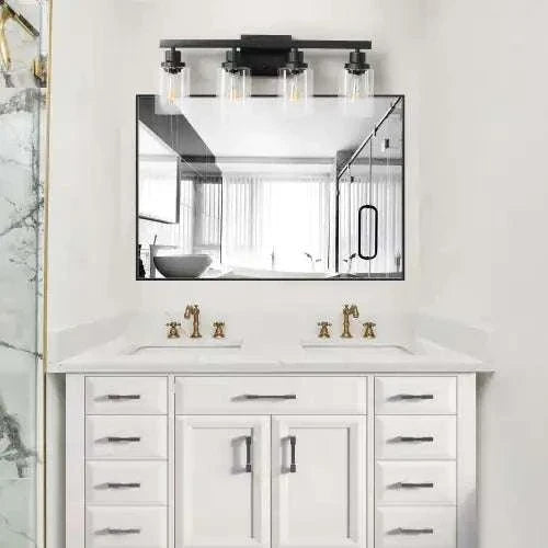 Rustic & Farmhouse lamp with black iron frame and four clear glass shades mounted above a double bathroom vanity mirror