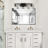 Rustic & Farmhouse lamp with black iron frame and four clear glass shades mounted above a double bathroom vanity mirror