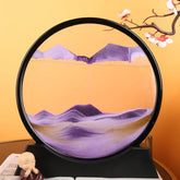 Sand Frame with a circular black acrylic enclosure containing layered purple and beige textured sand creating mountain-like patterns