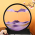 Sand Frame with a circular black acrylic enclosure containing layered purple and beige textured sand creating mountain-like patterns