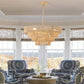 Bohemian woven rattan and iron farmhouse chandelier with adjustable chain and natural wood color.