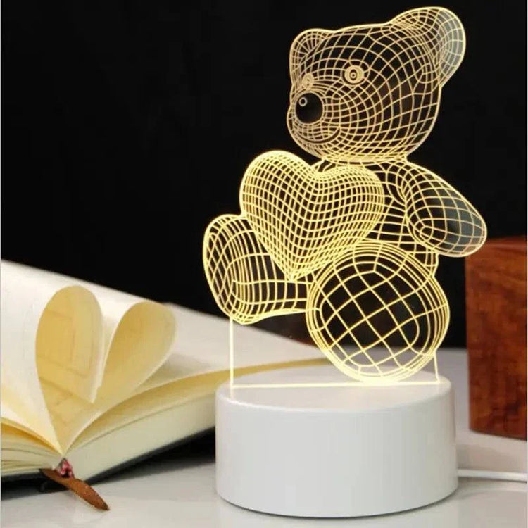 3D LED Lamp shaped like a teddy bear holding a heart, featuring a yellow optical illusion wireframe design on a white base