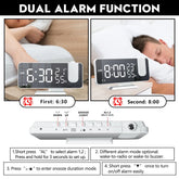 LED Digital Projection Clock with sleek black and white design, large clear digital display, and dual alarm function buttons on top panel.