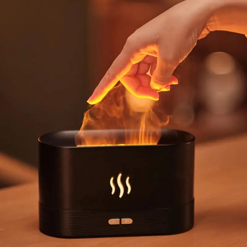 Flame Aroma Diffuser in black with a sleek design emitting a glowing flame-like mist and soft ambient light