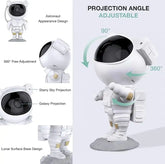 LED Astro Projector shaped like an astronaut with adjustable head for 360-degree starry sky and galaxy projections on a lunar surface base