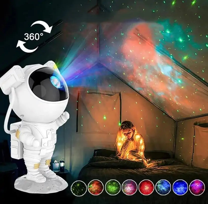 LED Astro Projector in white astronaut shape projecting colorful nebula and star patterns with 360-degree rotation effect