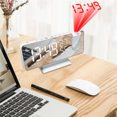LED Digital Projection Clock with sleek silver body, large white LED display, and red time projection feature on top right corner