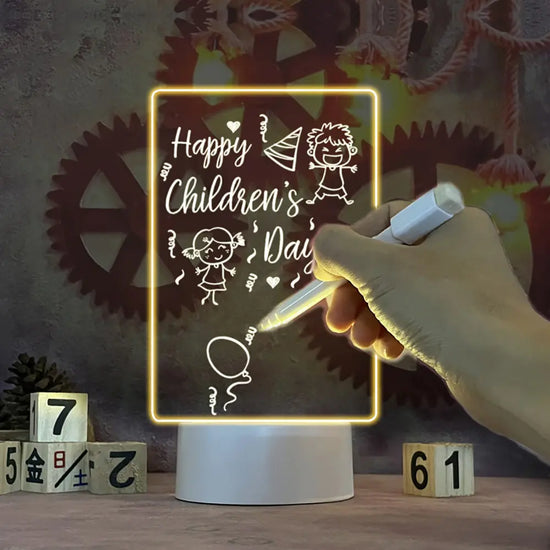 LED Note Board with yellow edge lighting on acrylic surface featuring white handwritten Children’s Day message and drawings