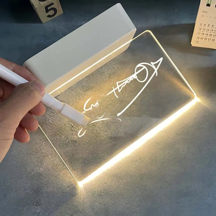 LED Note Board with clear acrylic panel illuminated by warm white LED lights, showing handwritten symbols and an arrow drawn with a white pen