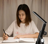 LED Study Lamp in black ABS with an adjustable dual-arm design and slim angled LED light bar