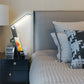 LED Study Lamp with slim black stand, angled white LED bar, and smartphone dock displaying the time