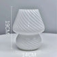 Mushroom LED Lamp made of clear white glass with diagonal swirl pattern, compact 19cm height and 14cm width design