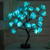 Rose Tree Lamp with glowing blue synthetic rose petals on black metal branches and base providing ambient lighting