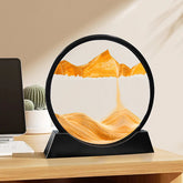 Sand Frame with black circular acrylic frame and vibrant orange sand creating dynamic layered landscape patterns